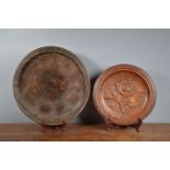 Two treen hardwood large plates/chargers, 19th and early 20th century, the largest 45cm diameter,