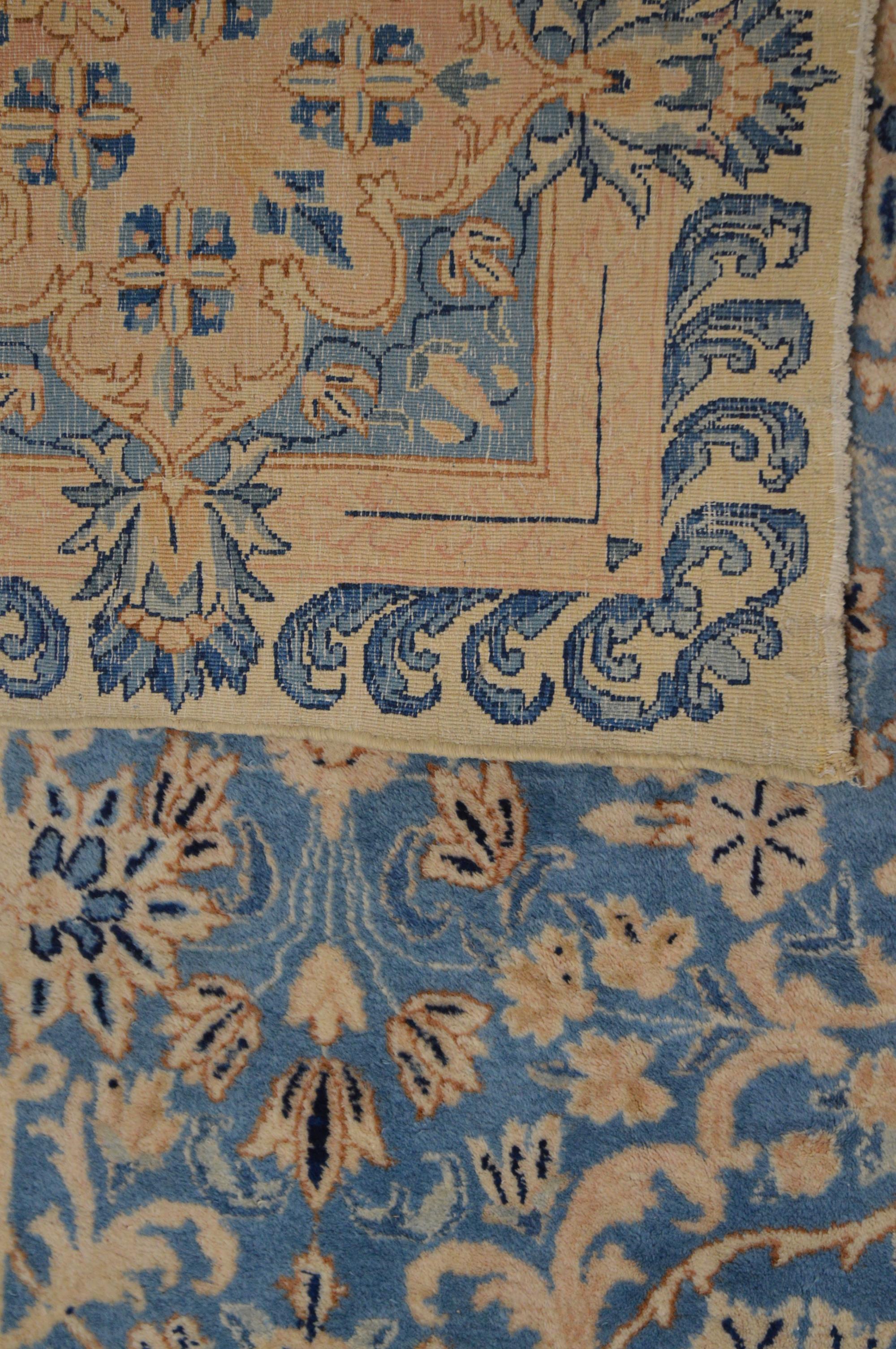 A very large Modern wool carpet, blue central ground with ivory border, some staining and moth - Image 4 of 4