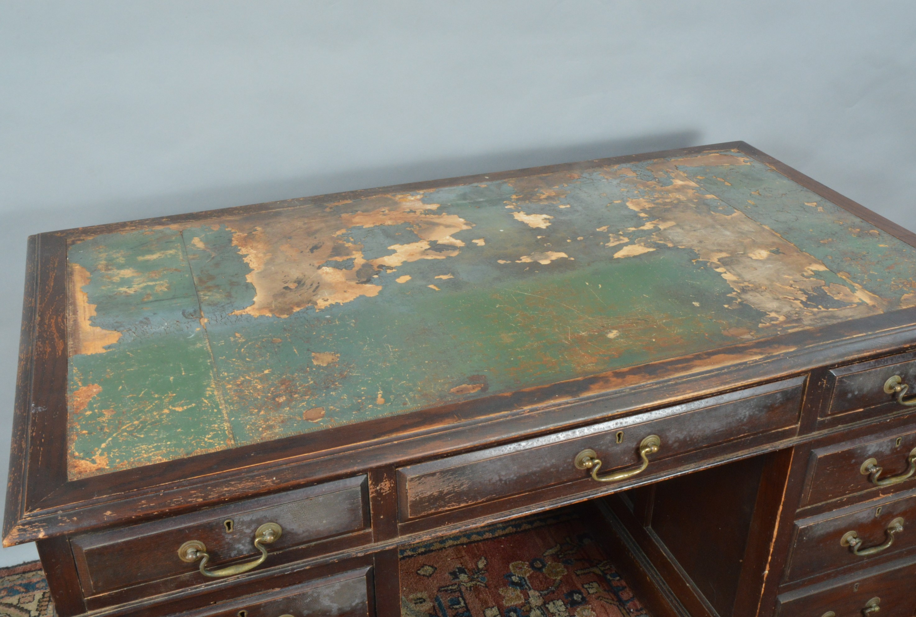 A 20th century twin pedestal desk, tooled leather top (AF), the frieze with two small and a larger - Image 2 of 2