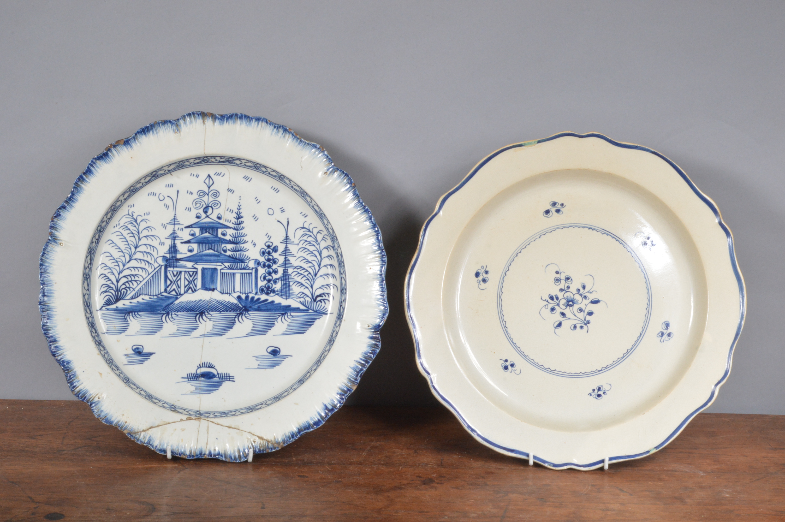 Two late 18th century pearlware chargers, one with shell edge decorated with a chinoiserie