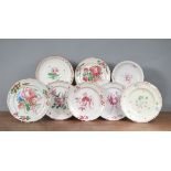 A group of mainly French 19th century faience plates, each decorated with floral designs. 23 - 25 cm