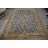 A large geometric blue and cream carpet, wool on cotton, 390cm x 292cm