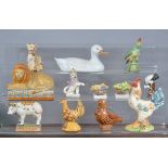 A mixed group of 19th and 20th century mainly Continental ceramic animals, to include a faience cow,