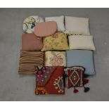 A collection of cushions, including a kilim example and a kilim salt bag AF (qty)
