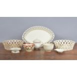 A group of early 19th century creamware, including two baskets, a basket stand, a covered custard