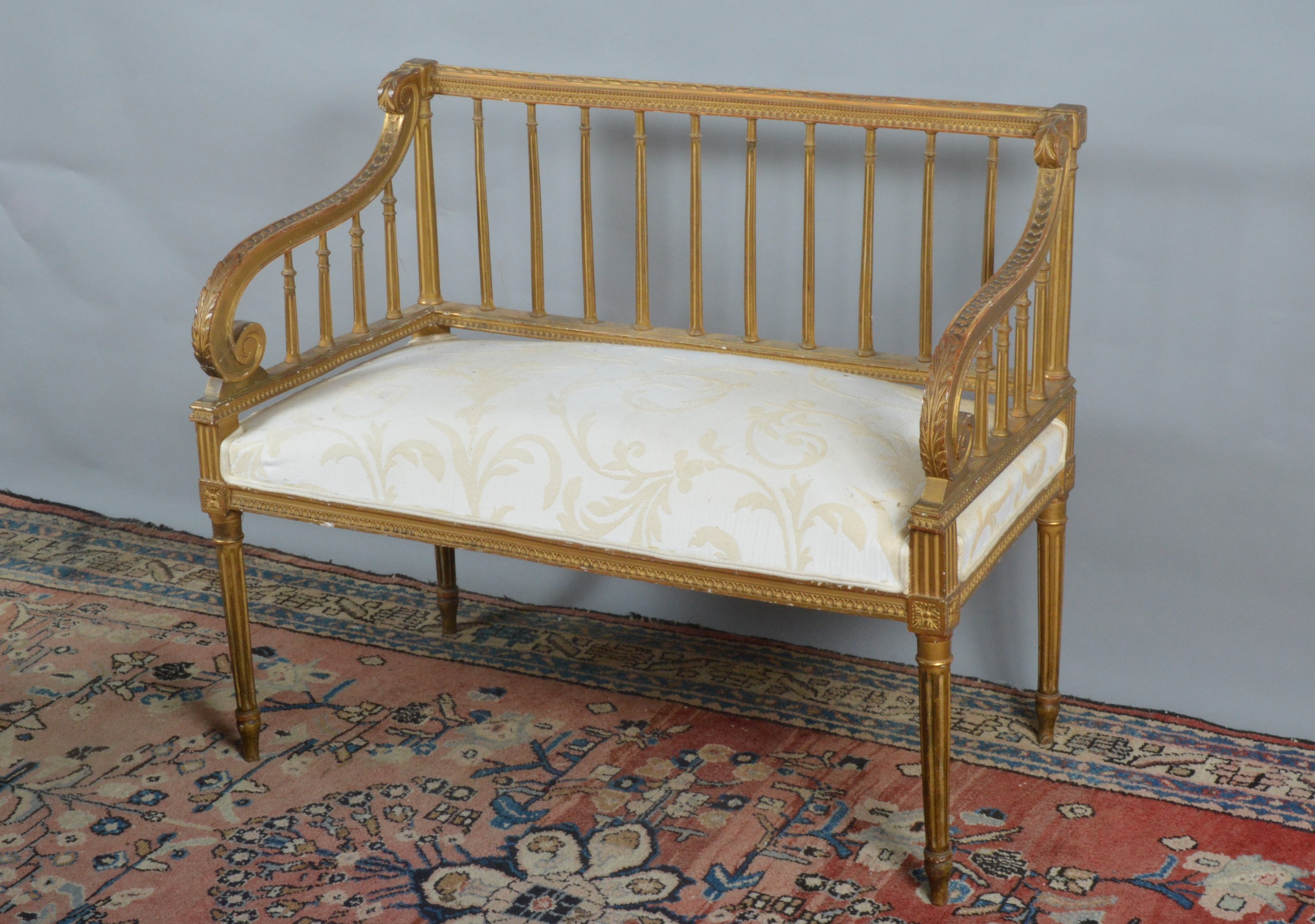 A French giltwood two person settee, fluted column back splat, ornate arms, upholstered seat, raised - Image 2 of 2