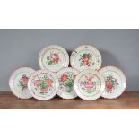 A group of mainly French 19th century faience plates, each decorated with floral designs. 23 cm