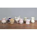 A group of early 19th century jugs, to include pink lustre, transfer-printed, a motto jug, and