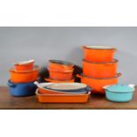 A large collection of Le Creuset kitchenware, comprising graduated crock pots and covers, the