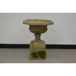 A neo classical style garden planter on square base, cast decoration. 63 cm tall. In two parts. Some