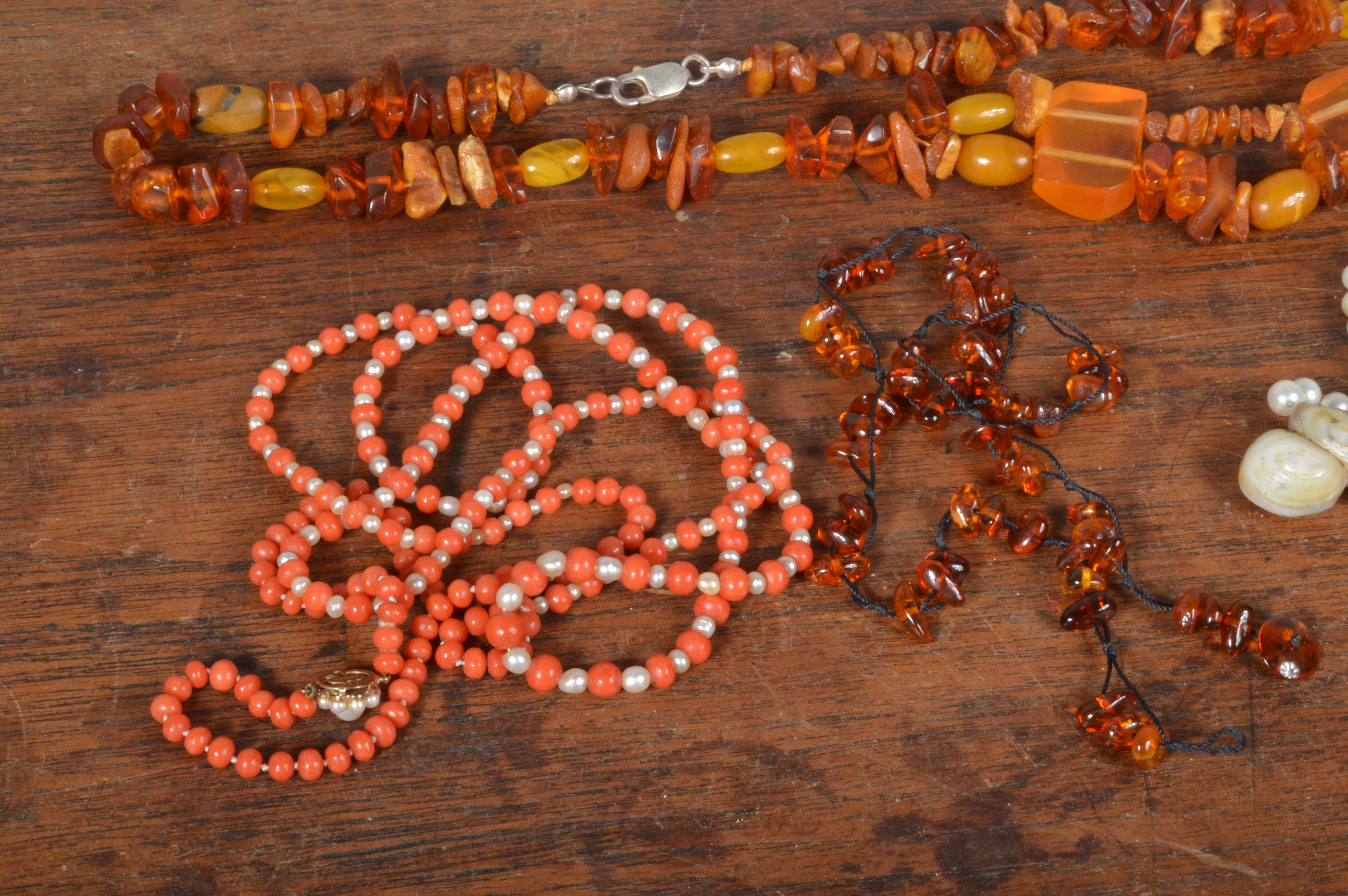 A small collection of organic jewels, including a string of coral and seed pearl beads on a 9ct gold - Image 3 of 3