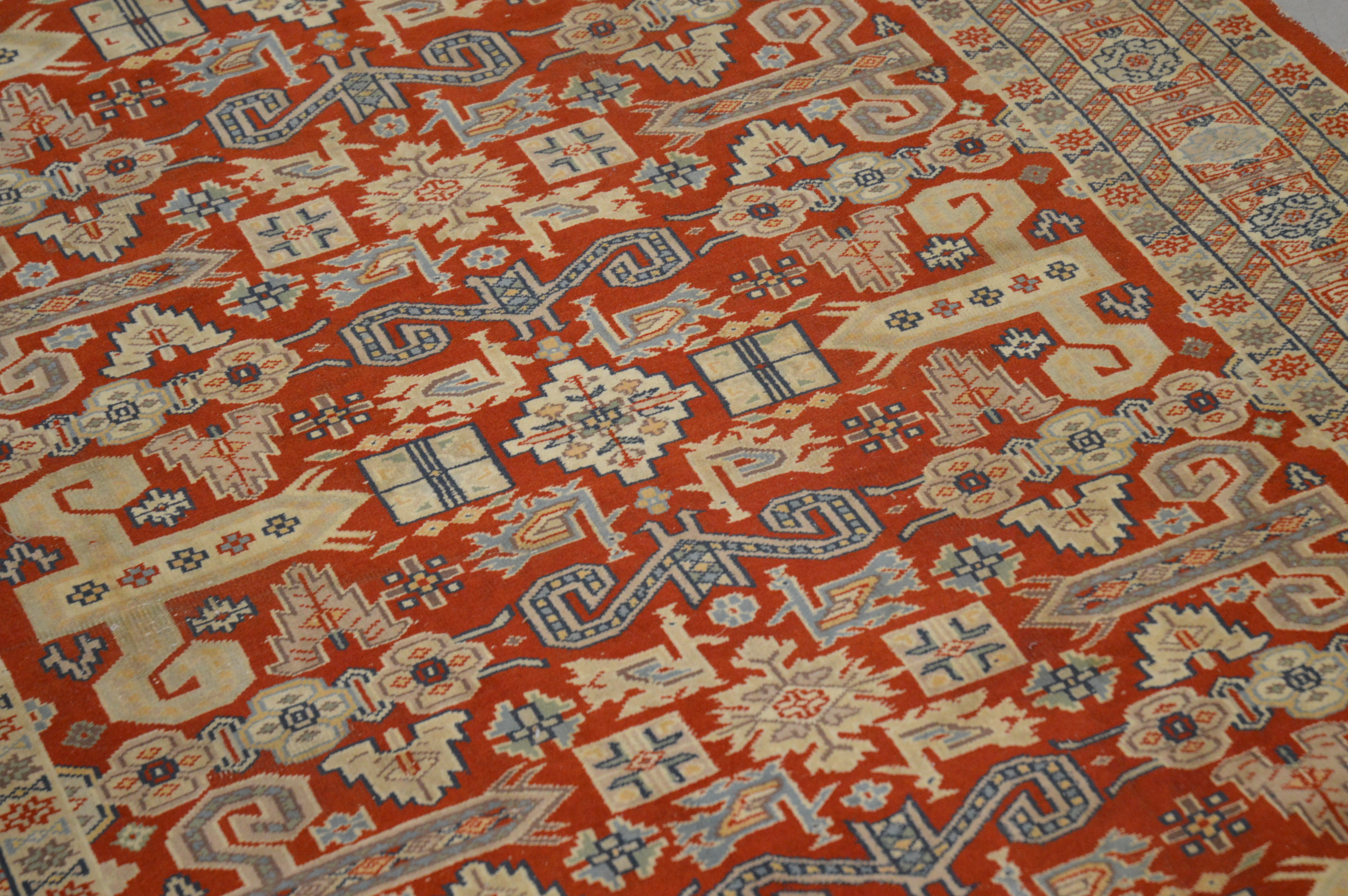 A Caucasian style wool on cotton rug, geometric design, faded and one corner with moth damage AF - Image 2 of 3