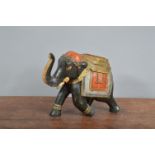 A wooden Indian elephant, hand-carved and hand-painted. 16 cm tall. Break to trunk and minor
