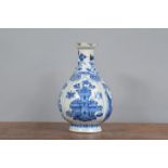 A 19th century Chinese hand-painted blue and white vase, decorated with four panels containing