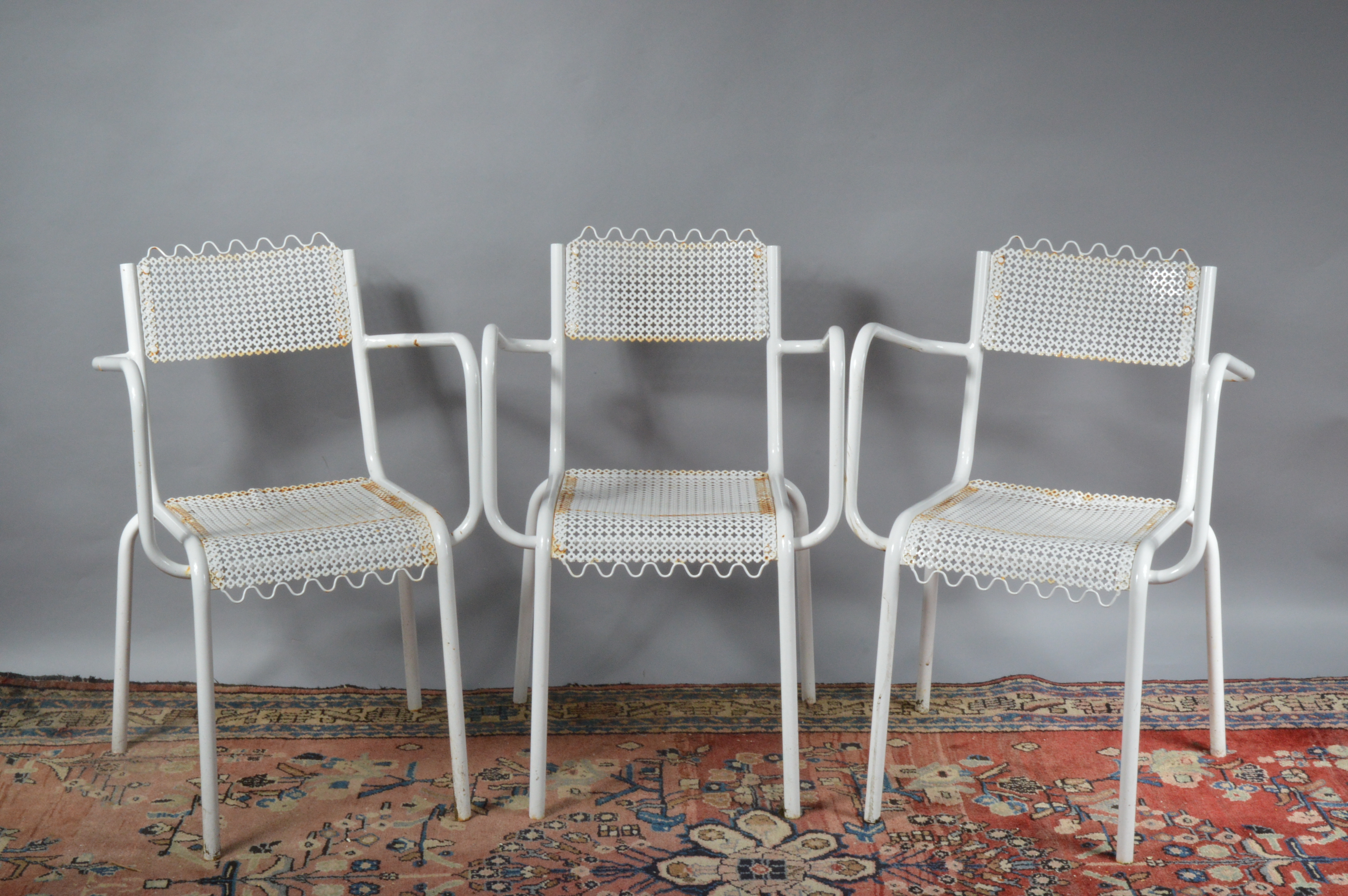 Three white-painted aluminium garden seats, pierced seats and backs, 76 cm tall, 48 cm wide. Some
