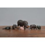 A collection of Hippopotamus figurines, of differing materials, including glass and wood, the
