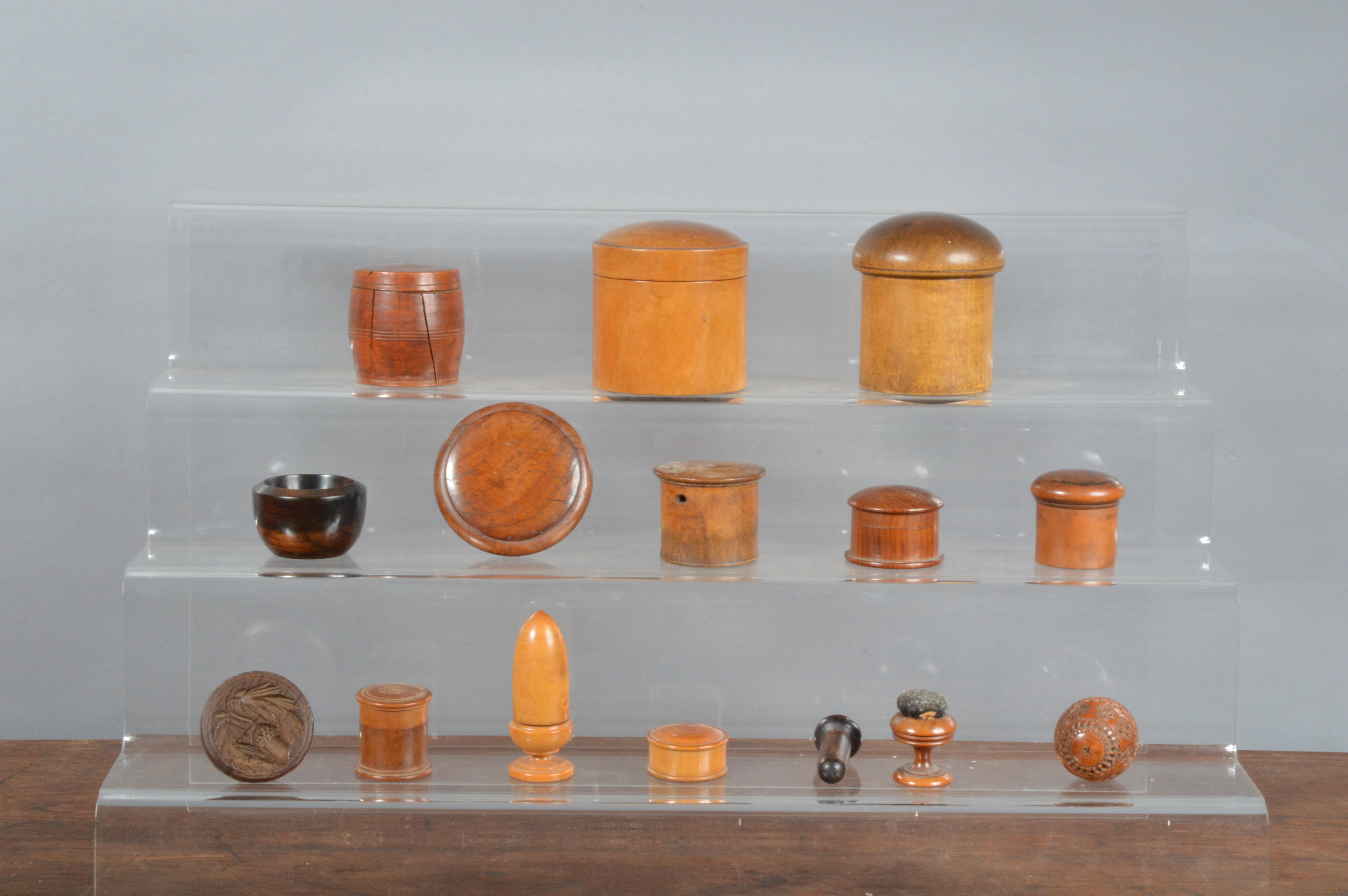 A collection of 19th century and later treen, the majority a variety of small storage boxes, the