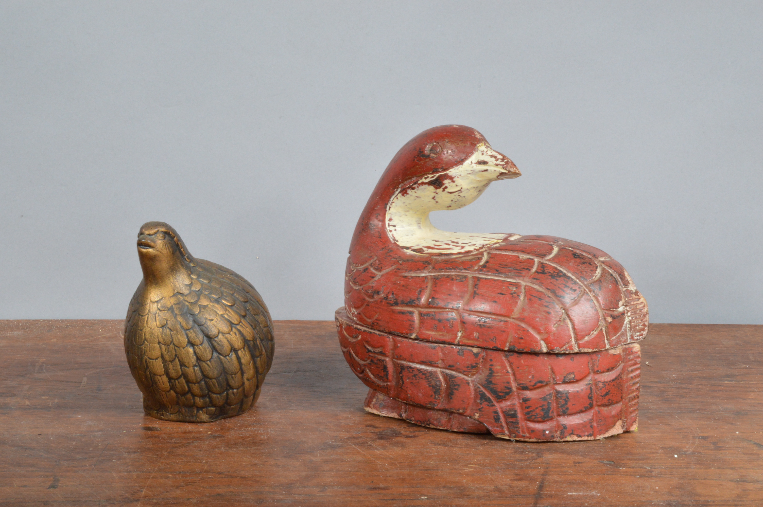 A carved wooden coot, painted in red and white as a box with removable lid, together with a small