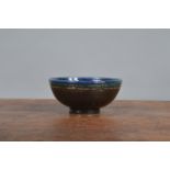 A 20th century studio pottery bowl, raku fired, crackle glaze, impressed monogram for Rupert Andrews