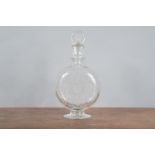 A Baccarat etched decanter, of circular moon flask shape for J & T Martell, Cognac. Etched shield to