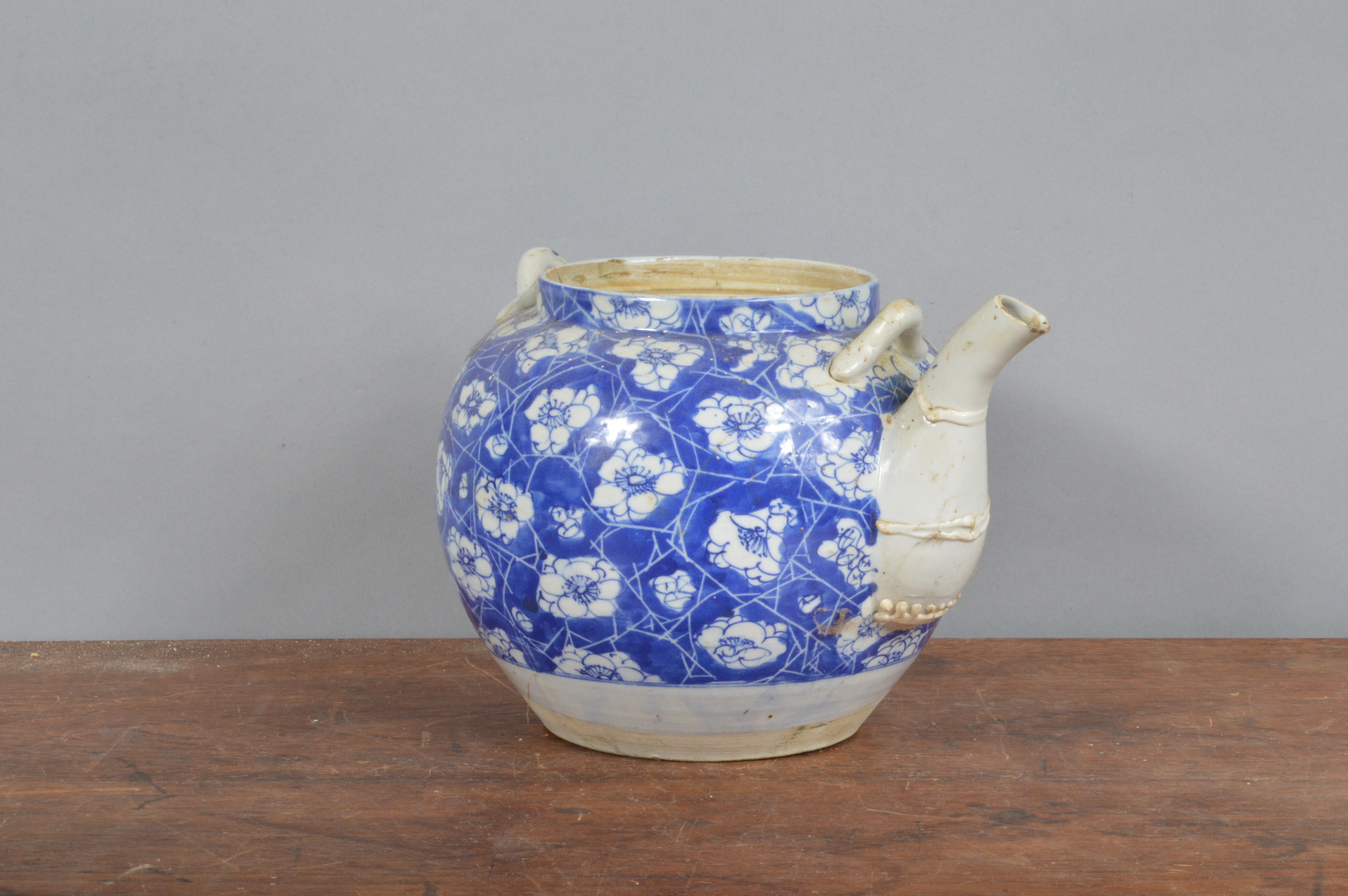 A 19th century Chinese hand-painted blue and white teapot, decorated with cracked ice and prunus. - Image 2 of 2
