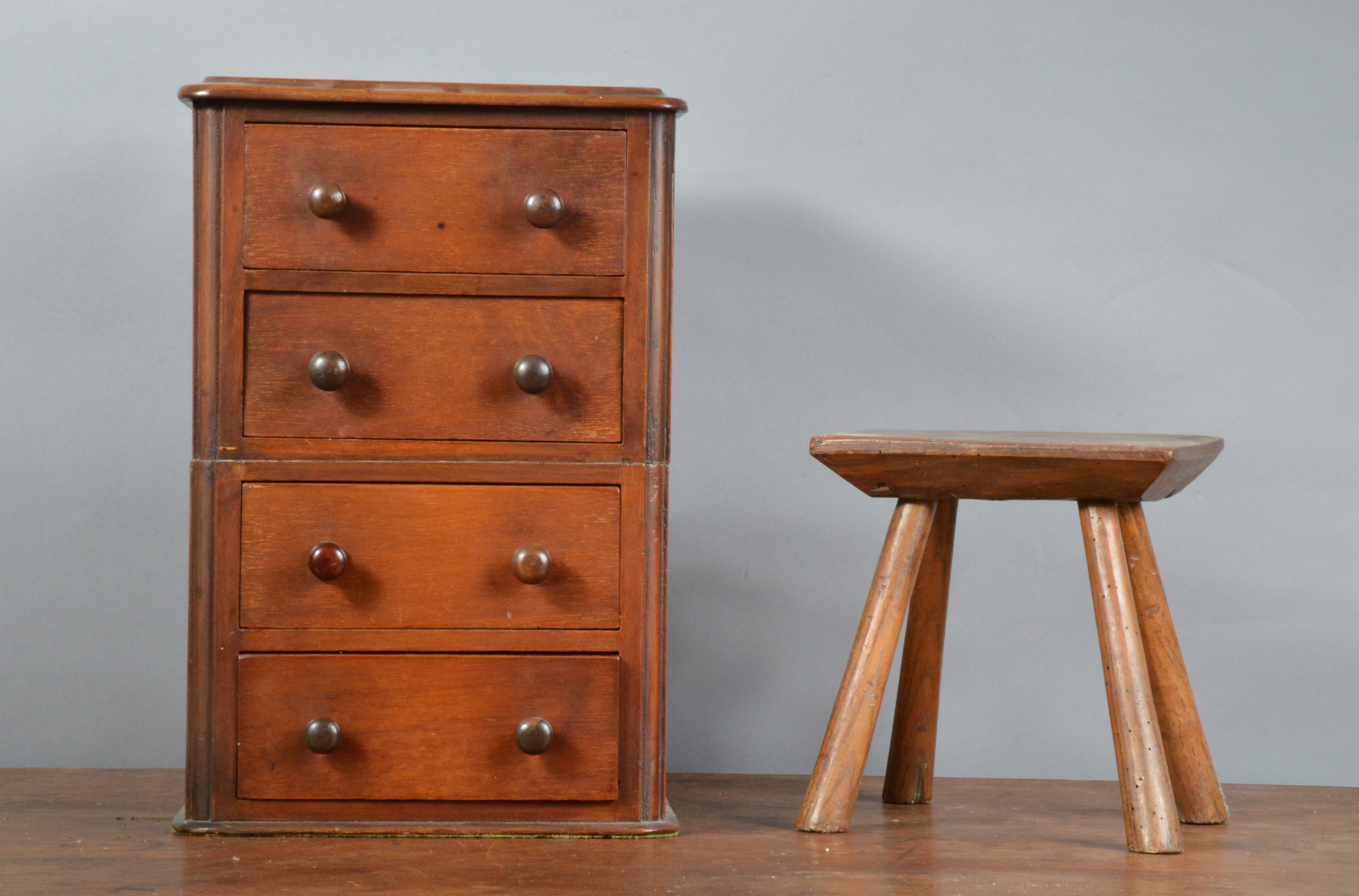 A small mahogany chest of drawers, with wooden knobs, 37cm H x 25cm W, together with a 19th