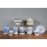 A group of early 19th century blue and white transfer-printed wares, to include three mugs, an