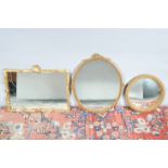 Three gilt framed mirrors, one rectangular, one oval and the other a small convex, all with some