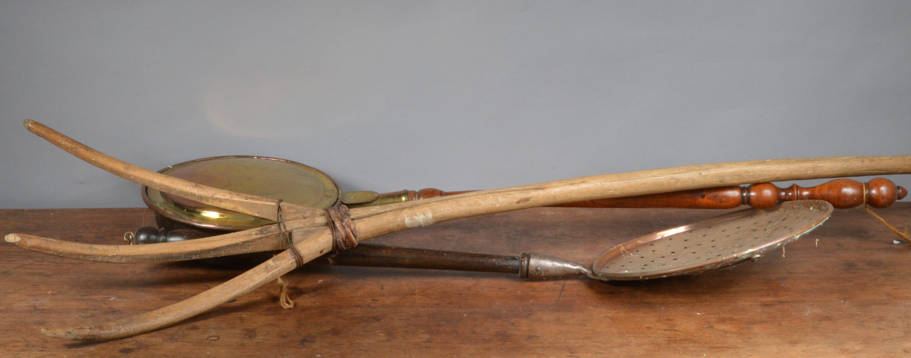 A 19th century mahogany and brass warming pan, together with a copper chestnut roasting scoop and