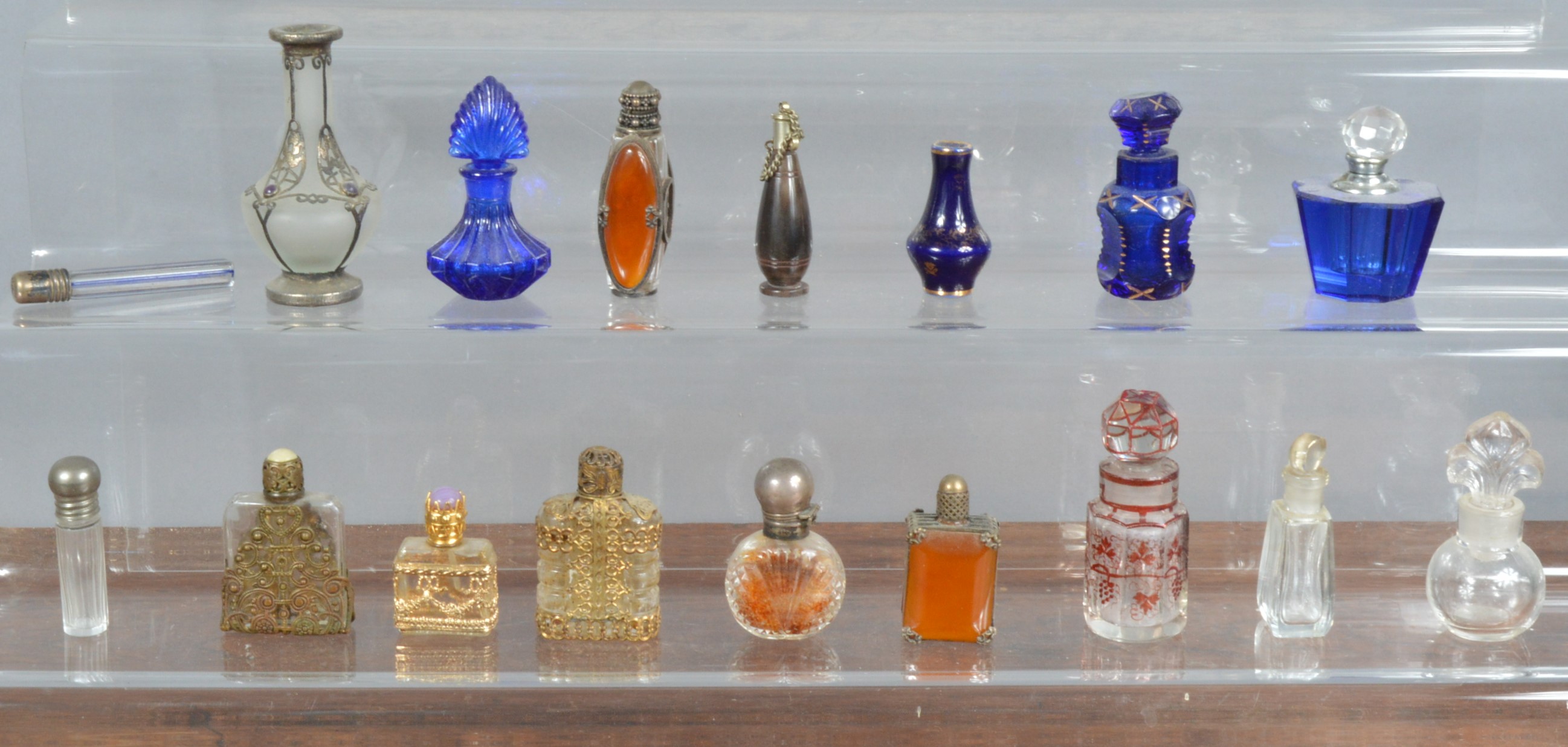 A collection of assorted scent bottles, to include cut glass, some with silver mounts, open