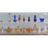 A collection of assorted scent bottles, to include cut glass, some with silver mounts, open