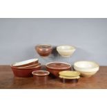 A collection of French ceramic cookware, including two ceramic mixing bowls, the largest 24cm in