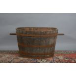 A very large 19th century copper bound washing bin or log bin, with some damage and wear, the