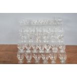 A collection of 19th century and later glass syllabub cups, some cut glass of differing sizes and