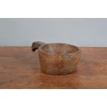 A 19th century treen hardwood scoop, circular bowl with a handle, later metal hanging loop, 26cm