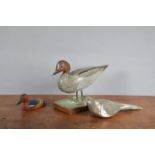 Three 19th century and later decoy animals, comprising a small Cinnamon Teal decoy duck by Jim