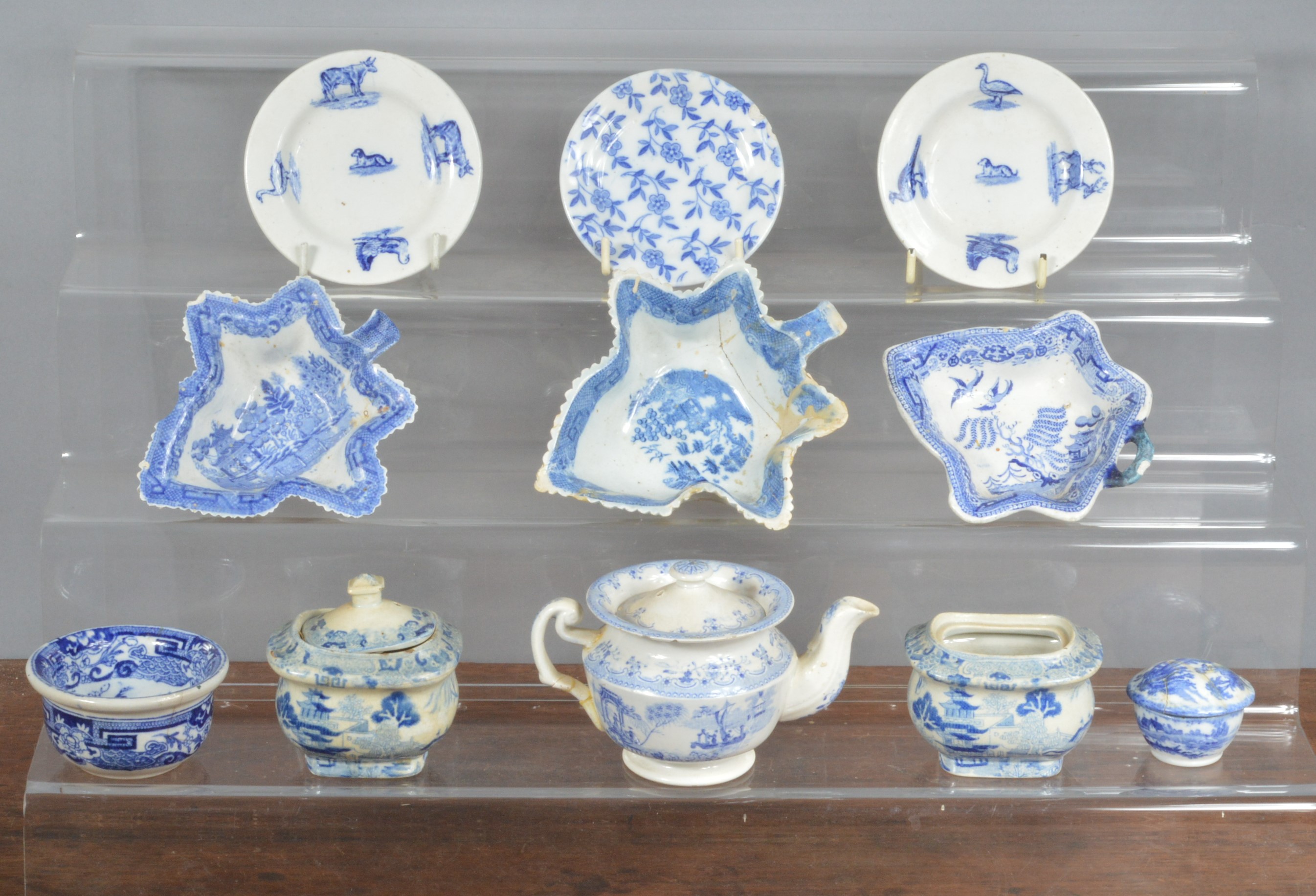 A group of mostly early 19th century blue and white transfer-printed wares, to include three