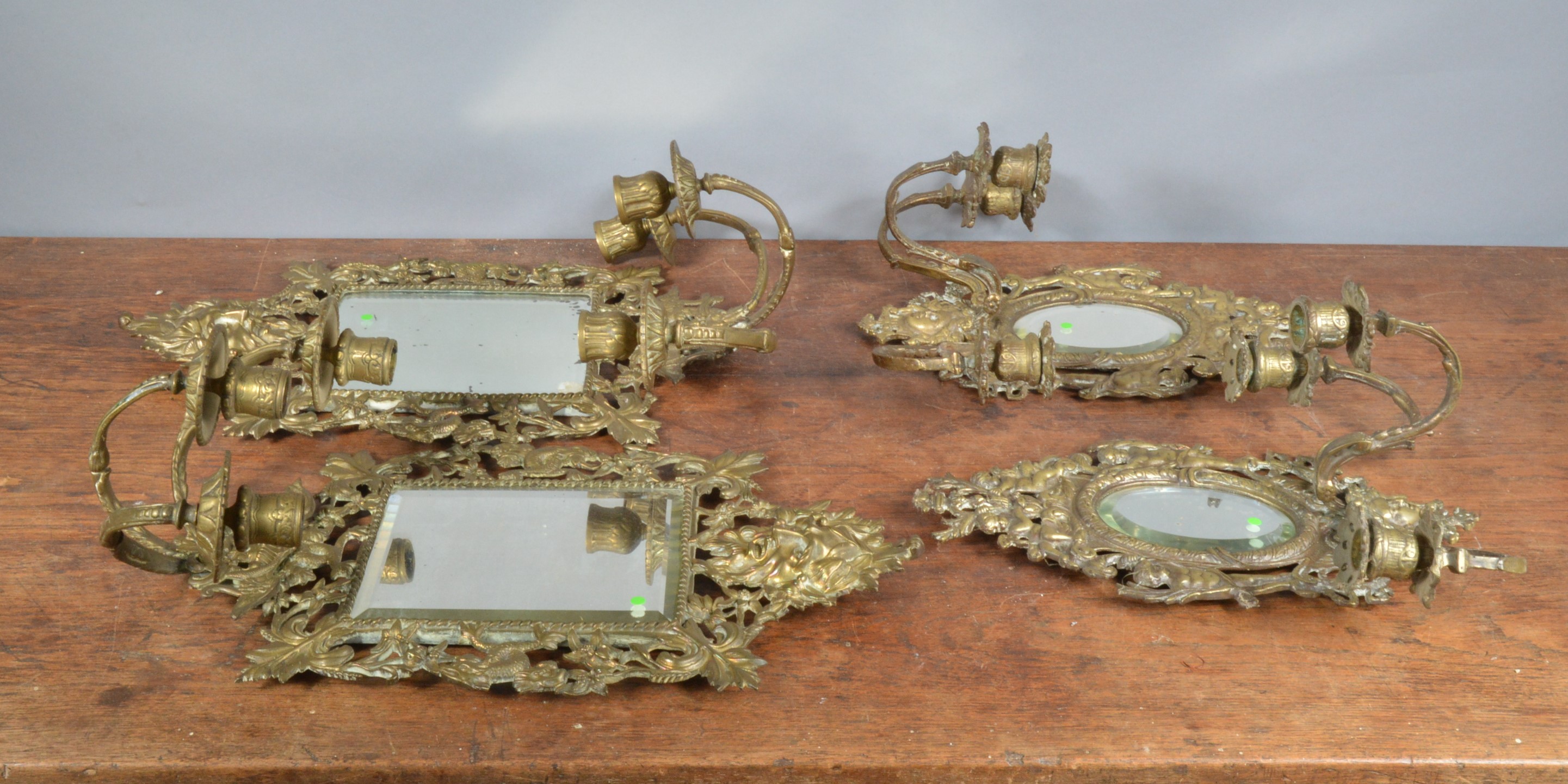 Two pairs of early 20th century mirrored brass wall sconces, each with three branches, one - Image 2 of 2