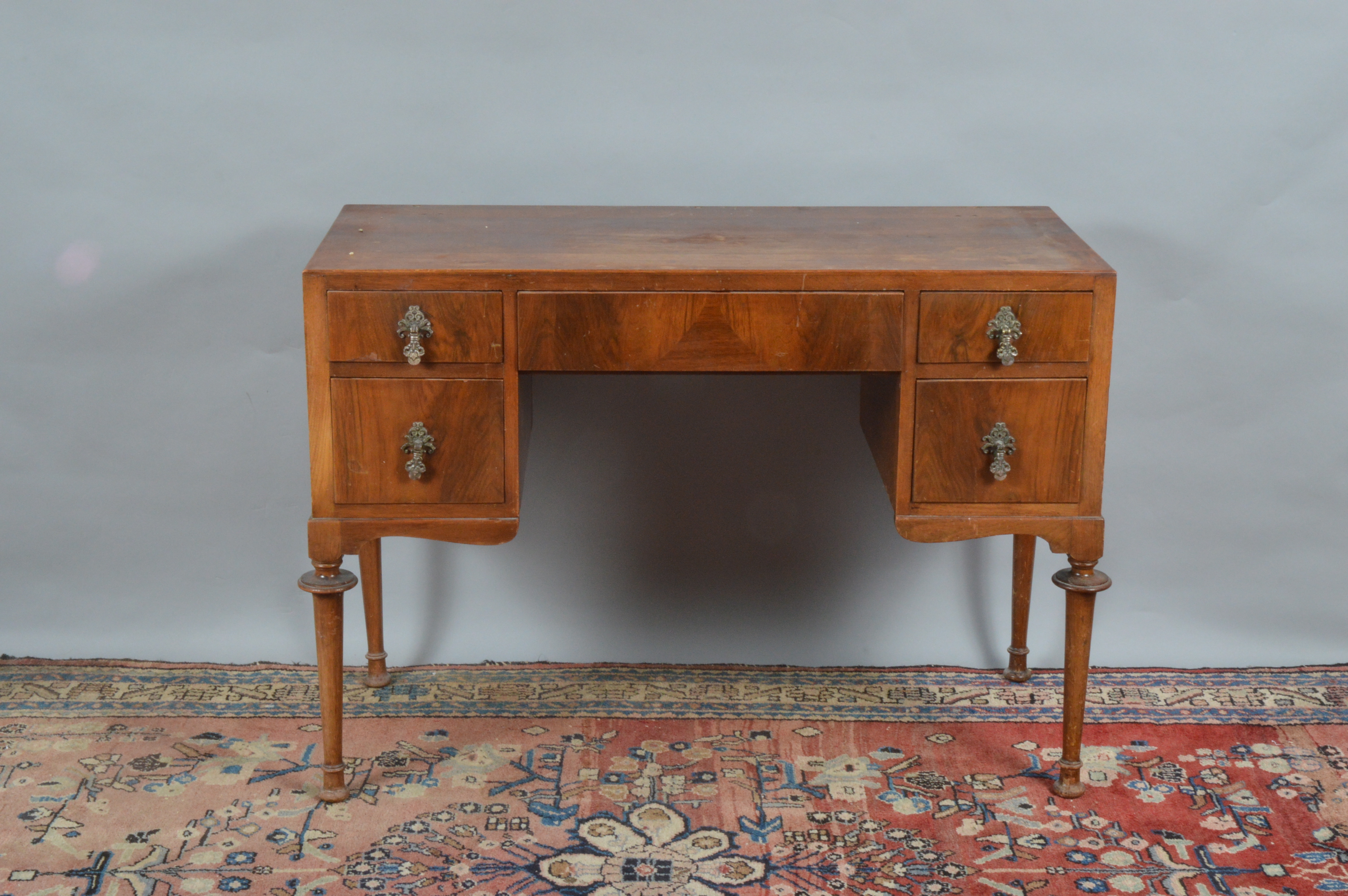 An Edwardian dressing table, missing the mirror top, one large central drawer without a handle, each