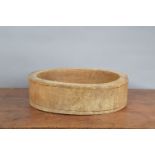 A large 19th century elm primitive treen straight sided bowl, with historic woodworm and other