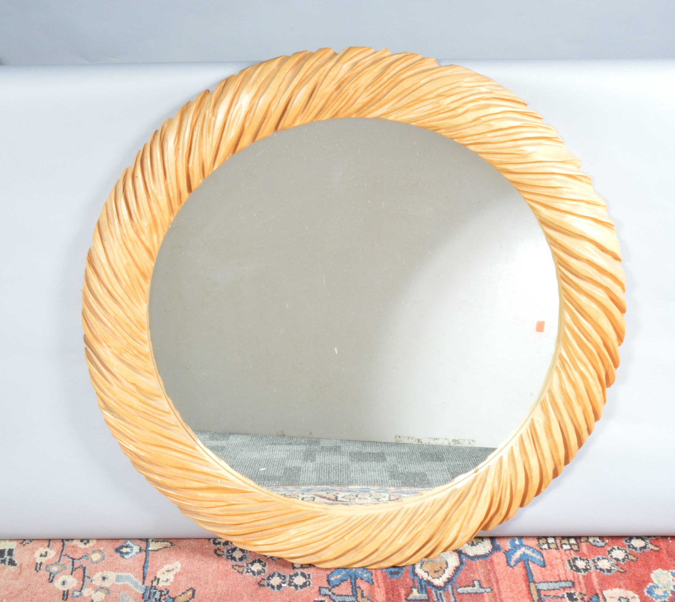 A modern circular mirror, crinkled' effect wooden frame, 79cm diameter