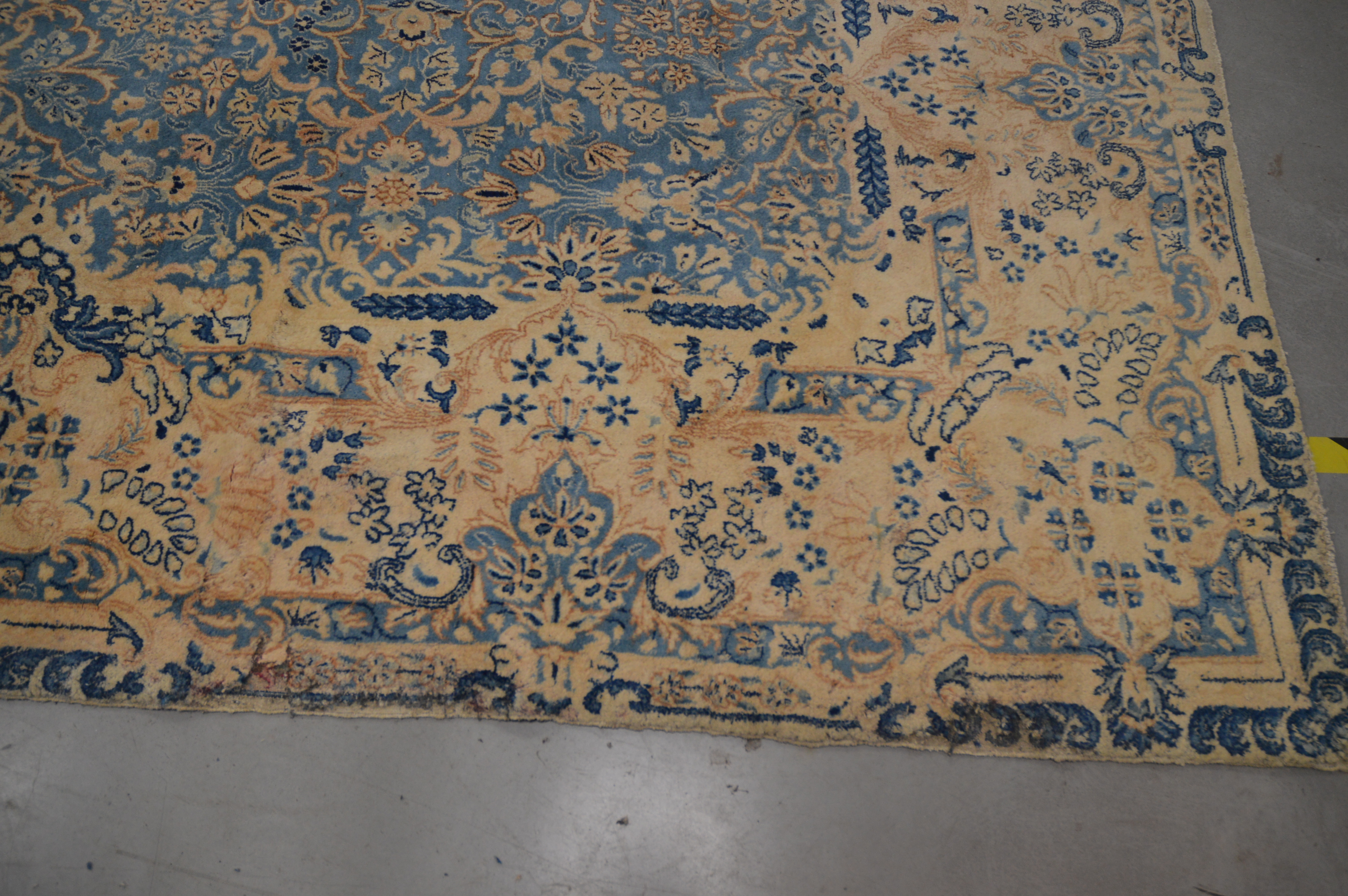 A very large Modern wool carpet, blue central ground with ivory border, some staining and moth - Image 3 of 4