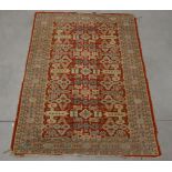 A Caucasian style wool on cotton rug, geometric design, faded and one corner with moth damage AF