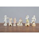 A group of mostly 19th century continental and British miniature figures, to include a small cupid