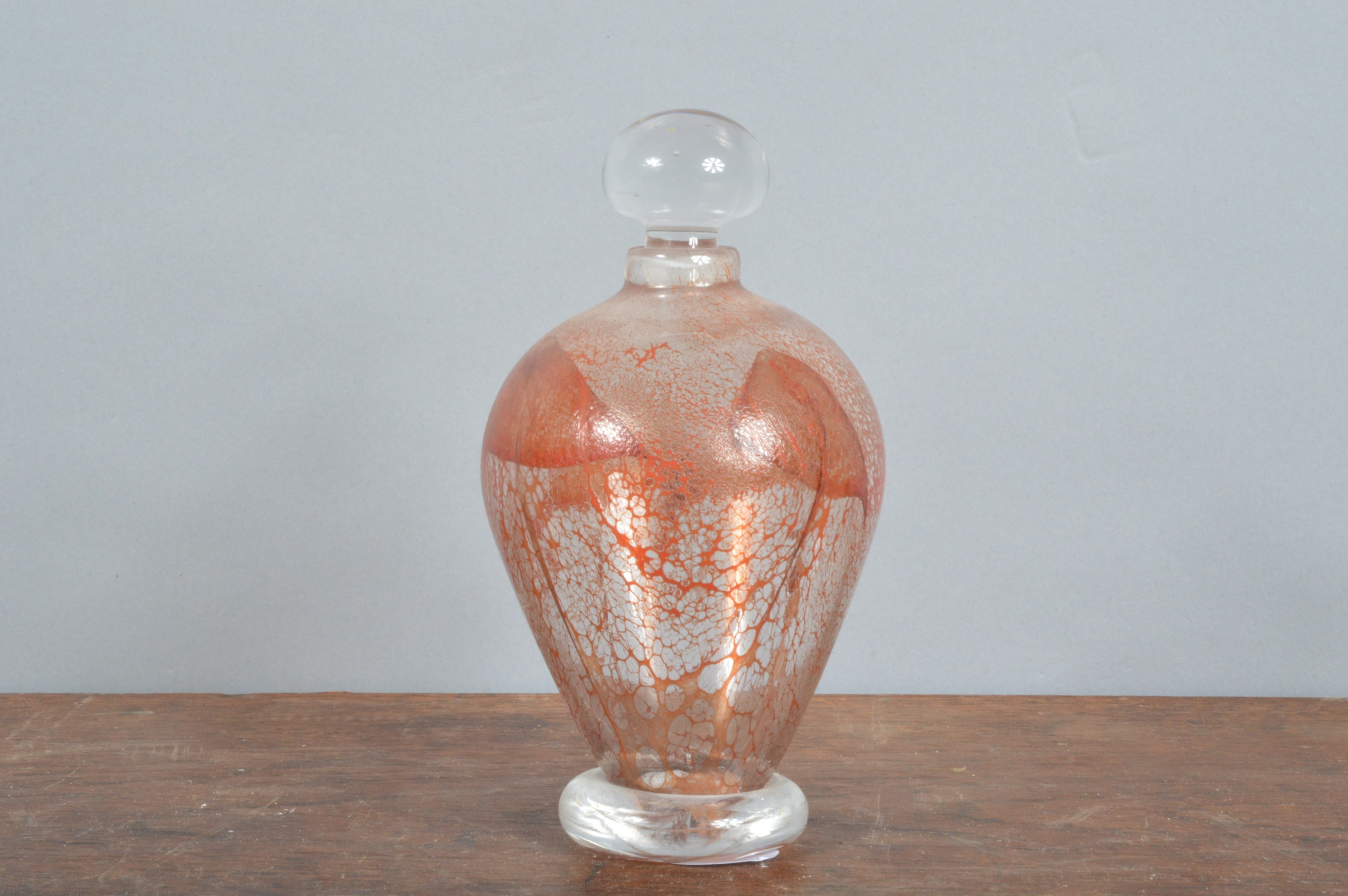 Martin Yeats (British 20th century), an iridescent ovoid bottle with stopper, signed to the
