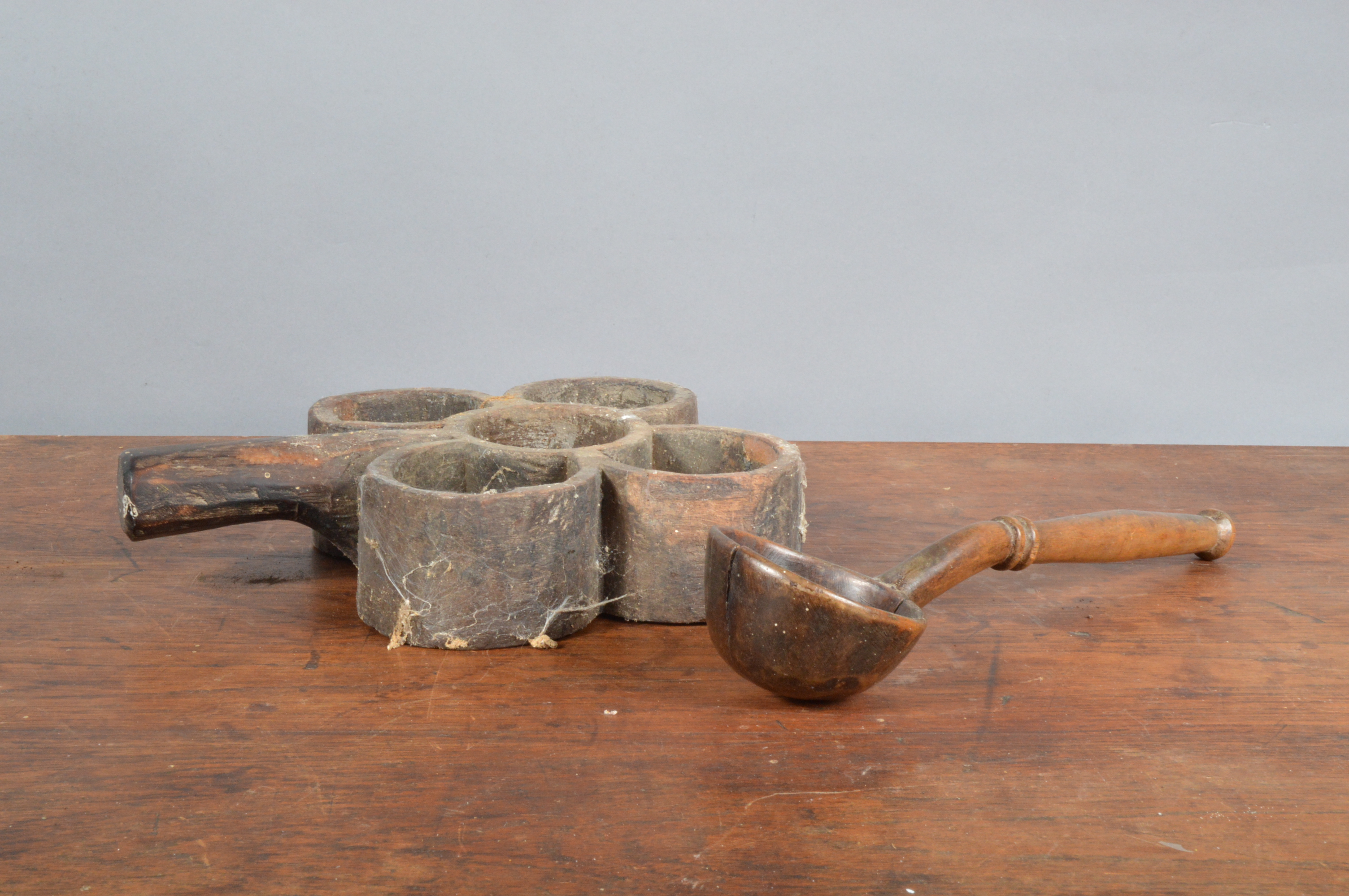 A 19th century far Indian primitive treen spice holder, with wear and traces of historic woodworm