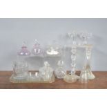 A collection of 19th century and later glass dressing table items, mostly cut glass, including a