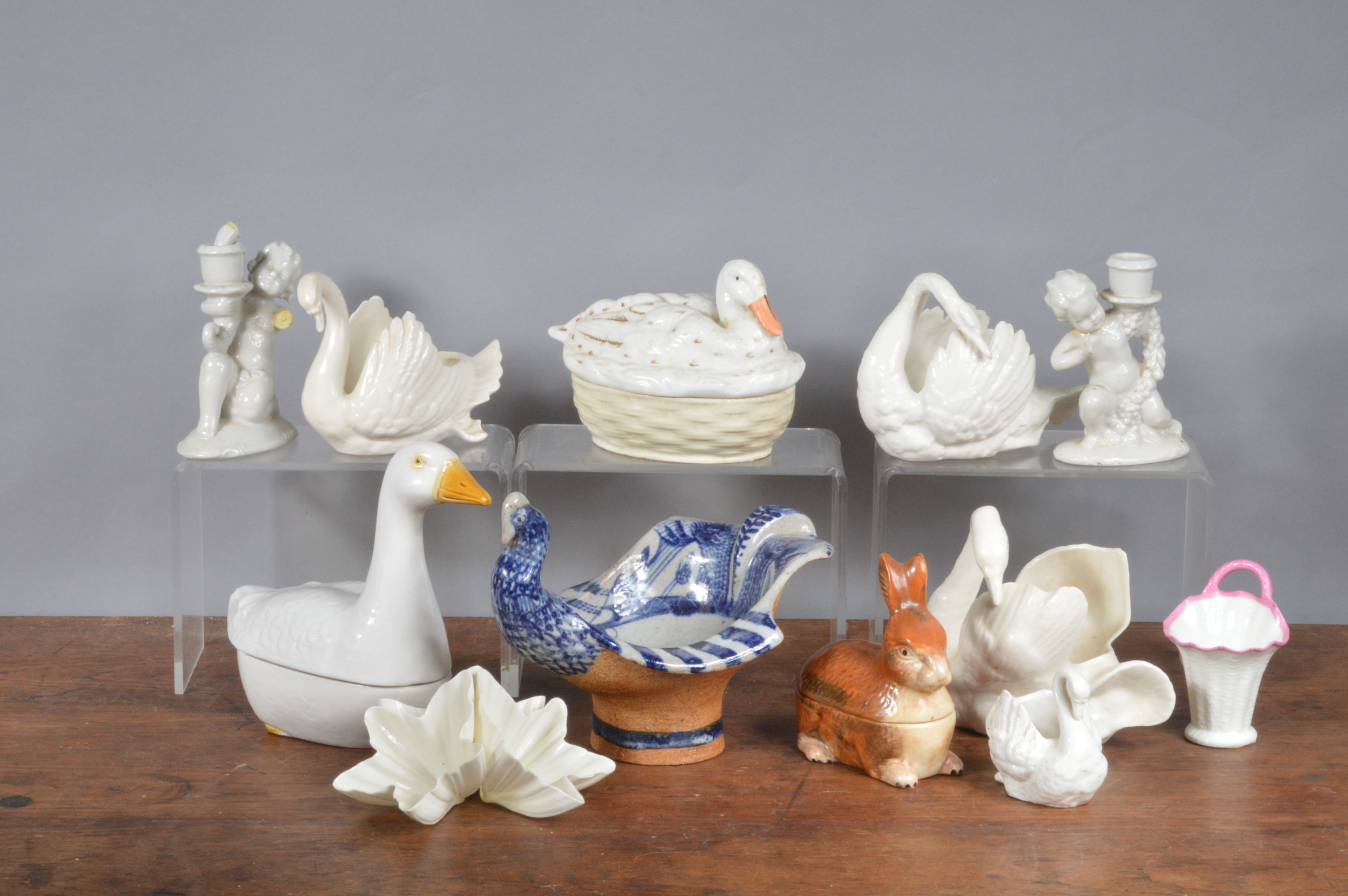 A group of mainly late 19th century continental wares, to include four white porcelain swans, two