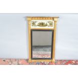 A 19th century and later gilt wood over mantle mirror, painted glass with a house and trees, the