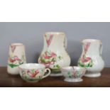 A group of French faience wares, all decorated with a cockerel, comprising of three jugs, a large